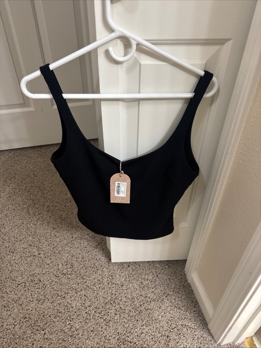 Meshki black dress top New with the tag size large